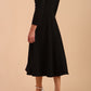 Model wearing diva catwalk Kate 3/4 Length Sleeve A-Line Swing Dress in Black back
