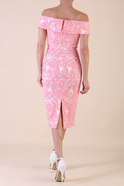 Model wearing diva catwalk Meryl Off Shoulder Floral Jacquard Dress in French Rose back