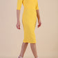Model wearing diva catwalk Harriet Elbow Sleeve Knee Lenght Jacquard Dress in Lemon colour side