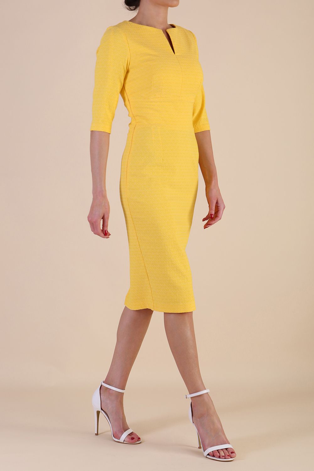 Model wearing diva catwalk Harriet Elbow Sleeve Knee Lenght Jacquard Dress in Lemon colour side