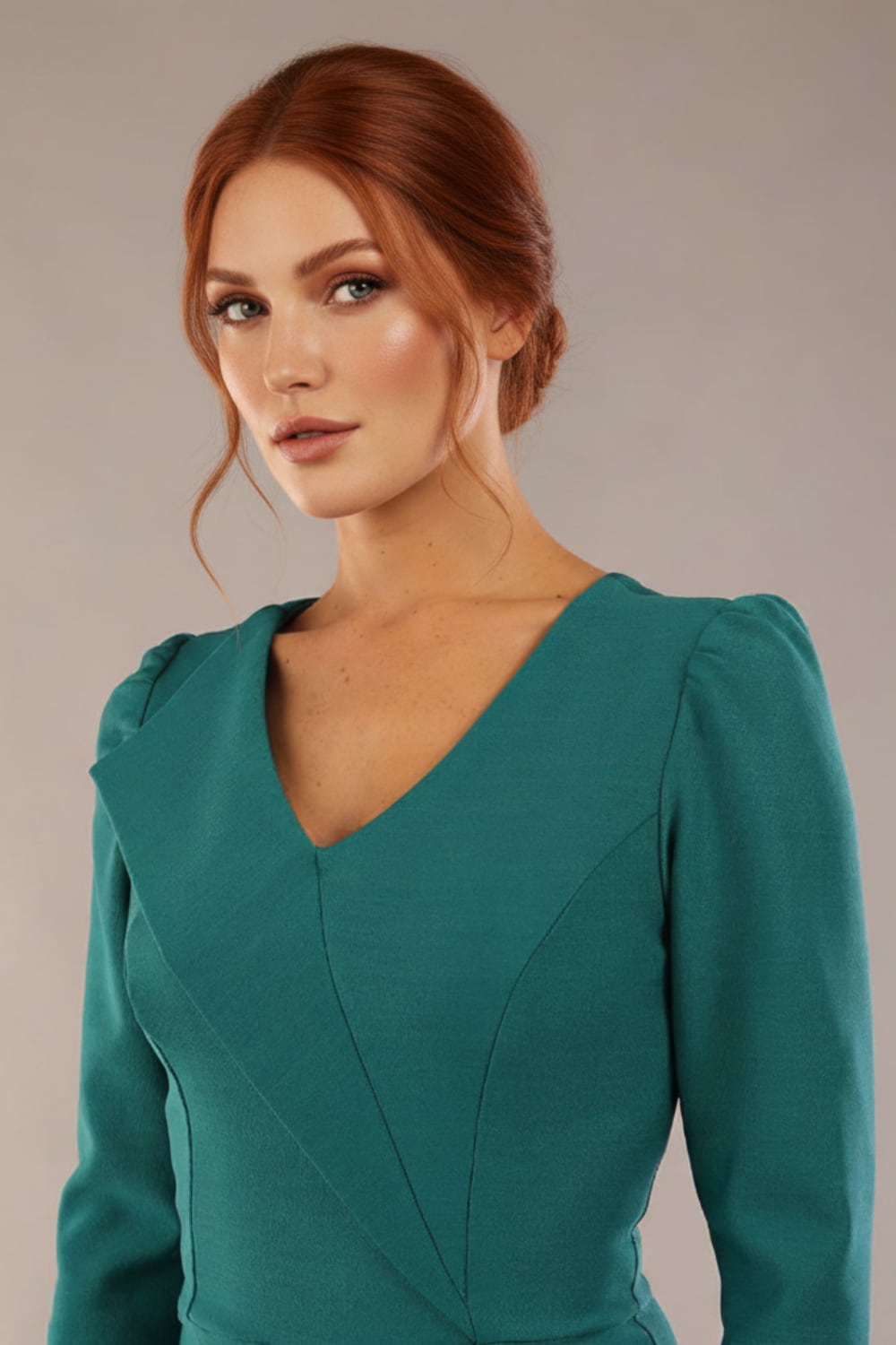 Close-up of the architectural asymmetric folded lapel on the SEED Cyrus dress in pacific green (Pacific Green)