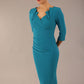 brunette model is wearing a diva catwalk Indira 3/4 Sleeve Knee Length Pencil Dress collar detail in magic blue colour front