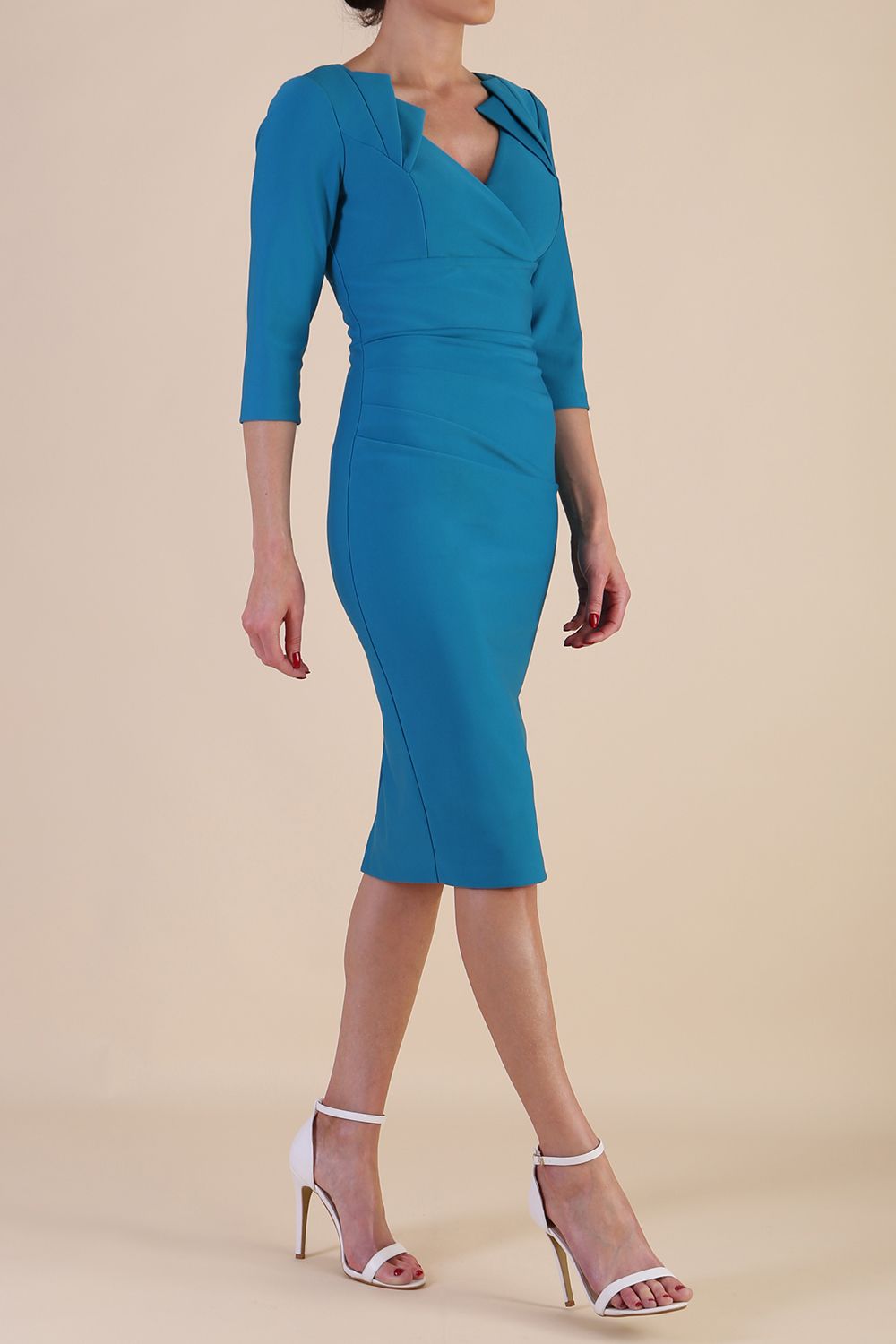 Model wearing diva catwalk Indira 3/4 Sleeve Knee Lenght Pencil Dress in Mosaic Blue side