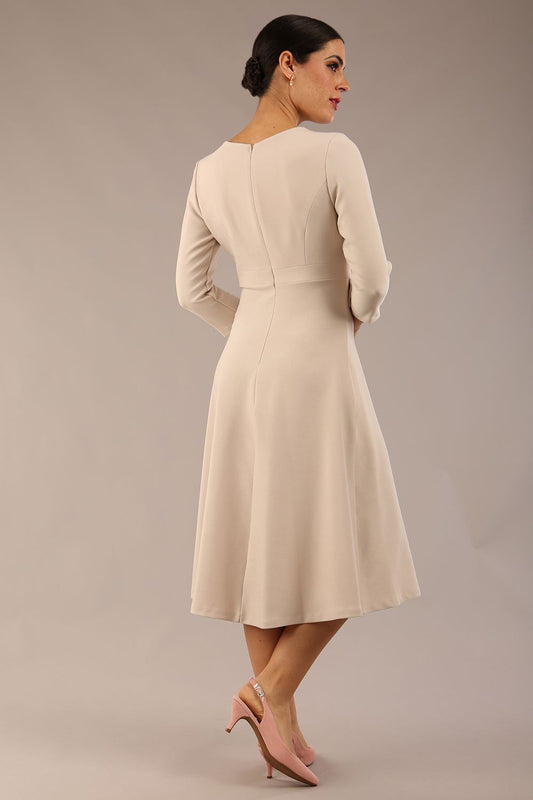 Model wearing diva catwalk Gresham 3/4 Sleeve Knee Length A-Line Dress in Sandy Cream back