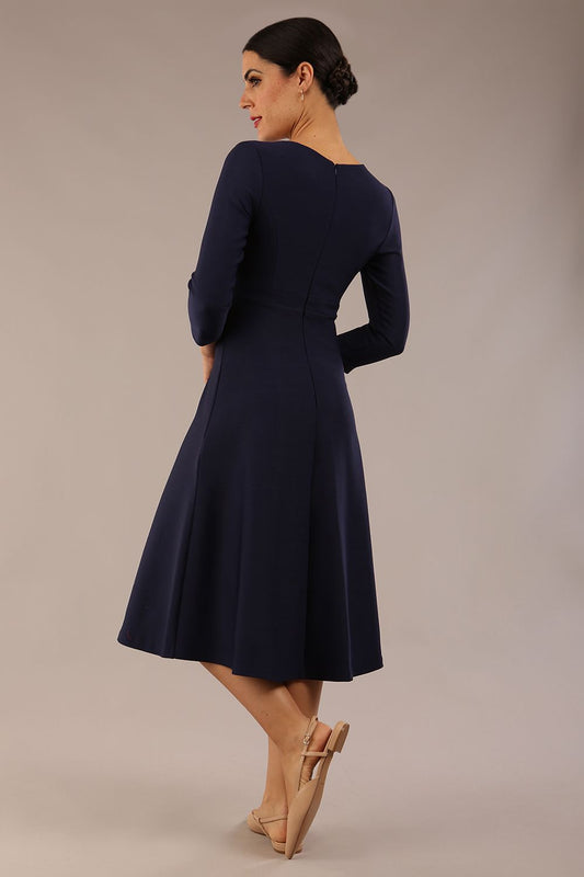 Model wearing diva catwalk Gresham 3/4 Sleeve Knee Length A-Line Dress in Navy Blue back