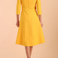 Model wearing diva catwalk Gresham 3/4 Sleeve Knee Length A-Line Dress in Daffodil Yellow back
