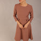 brunette Model wearing diva catwalk Gresham 3/4 Sleeve Knee Length A-Line Dress in Acorn brown colour front image with sunglasses