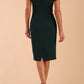 Model wearing a diva catwalk Sheena Short Sleeve with an open split Knee Length Pencil Dress with Diamond Neckline in Forest Green colour back