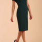Model wearing a diva catwalk Sheena Short Sleeve with an open split Knee Length Pencil Dress with Diamond Neckline in Forest Green colour front side