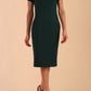 Model wearing a diva catwalk Sheena Short Sleeve with an open split Knee Length Pencil Dress with Diamond Neckline in Forest Green colour front