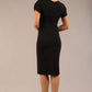 brunette Model wearing a diva catwalk Sheena Short Sleeve with an open split Knee Length Pencil Dress with Diamond Neckline in Black colour back