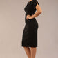 brunette Model wearing a diva catwalk Sheena Short Sleeve with an open split Knee Length Pencil Dress with Diamond Neckline in Black colour front