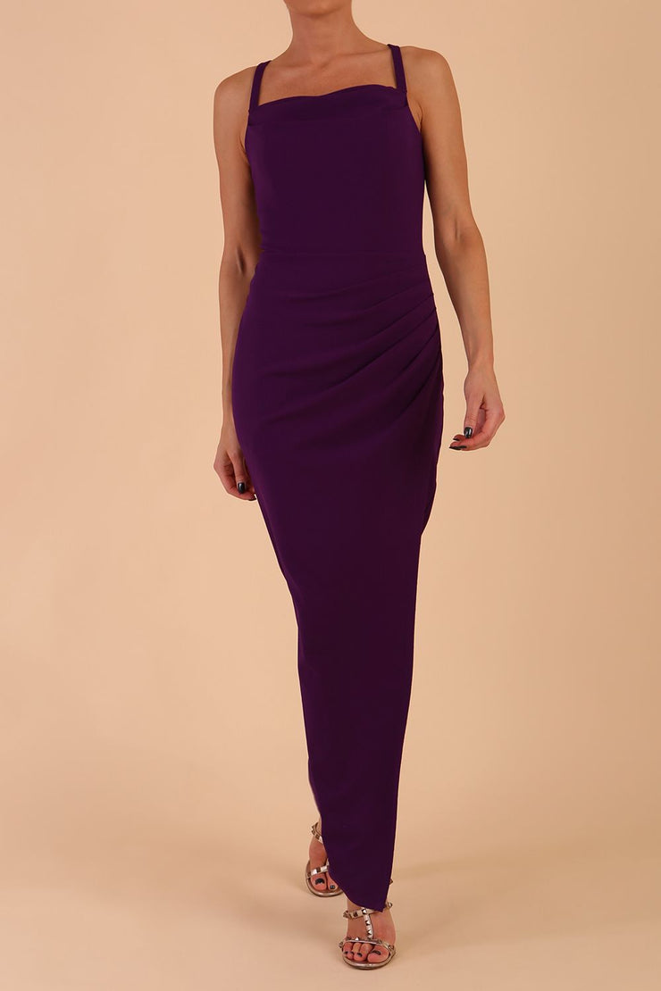 Model wearing Sabrina Maxi Dress with square neckline, sleeveless style, pleating details and side open split, open back in Passion Purple front