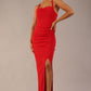 Model wearing Sabrina Maxi Dress with square neckline, sleeveless style, pleating details and side open split, open back in Scarlet Red 