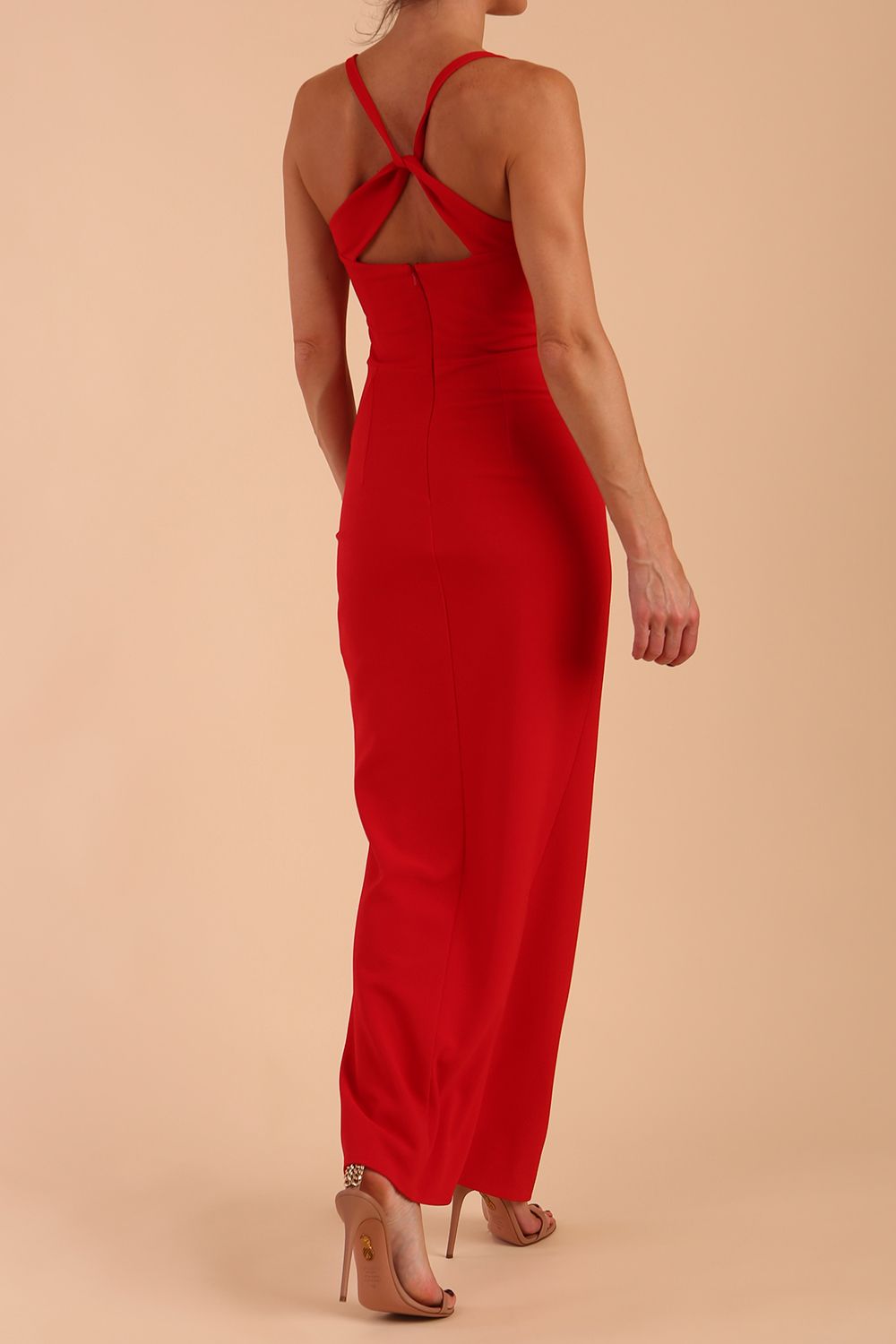 Model wearing Sabrina Maxi Dress with square neckline, sleeveless style, pleating details and side open split, open back in Scarlet Red back side