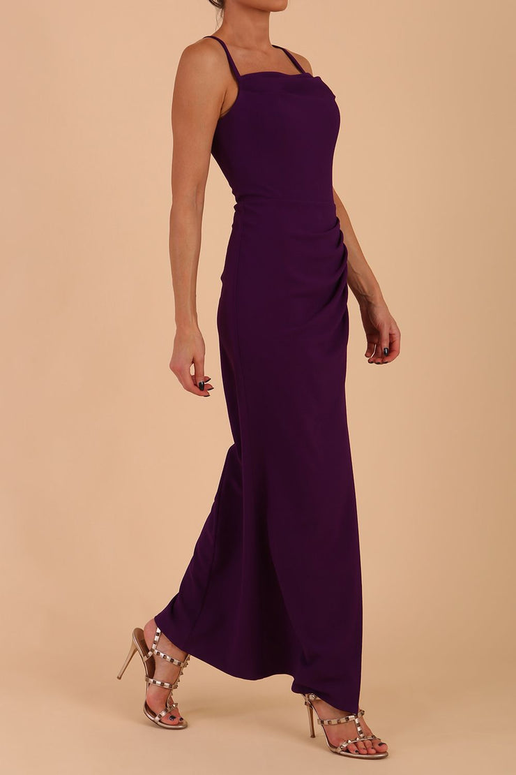 Model wearing Sabrina Maxi Dress with square neckline, sleeveless style, pleating details and side open split, open back in Passion Purple front side