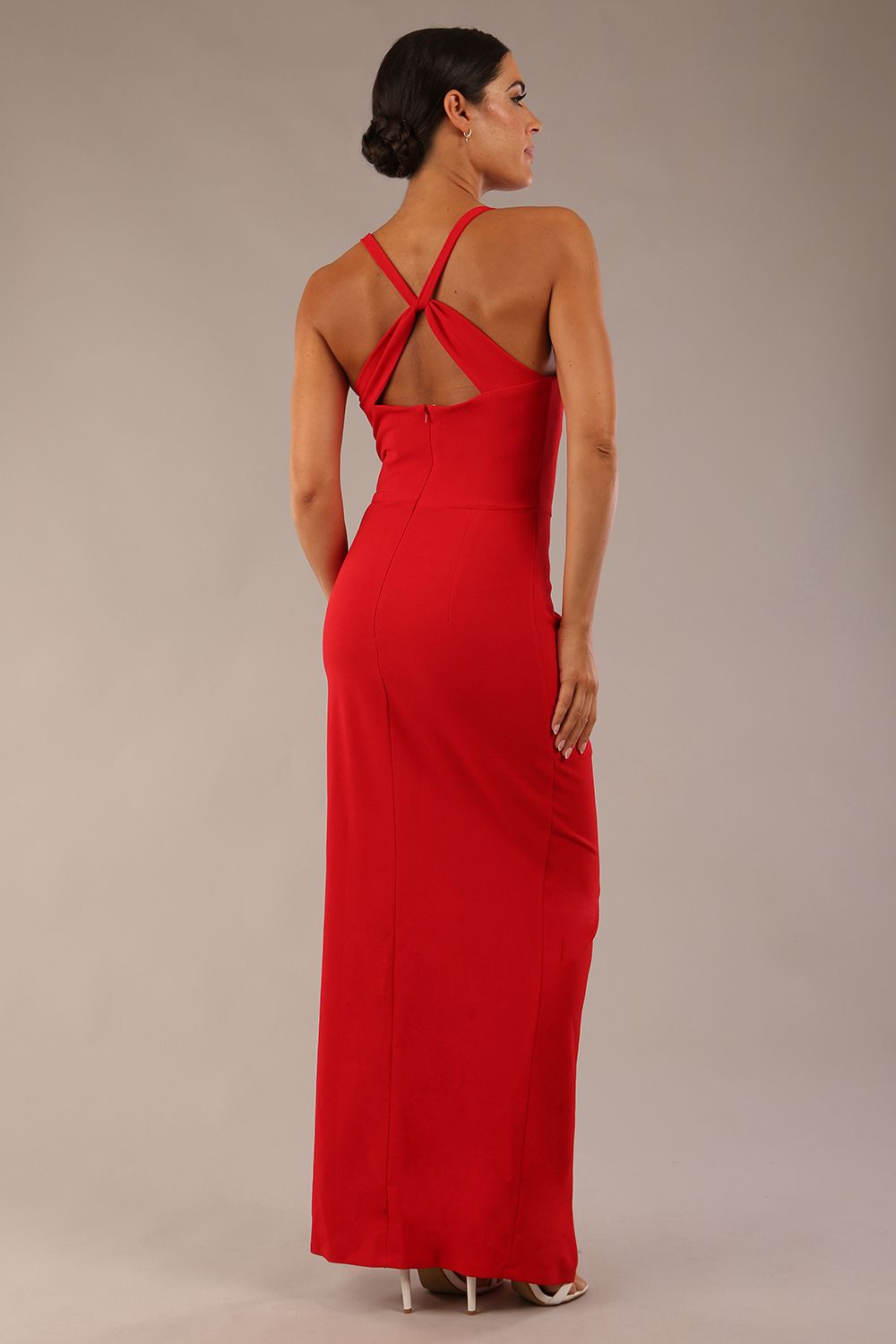 Model wearing Sabrina Maxi Dress with square neckline, sleeveless style, pleating details and side open split, open back in Scarlet Red 