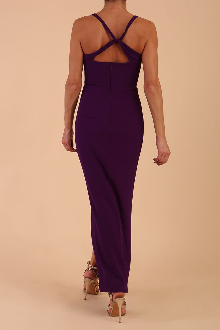 Model wearing Sabrina Maxi Dress with square neckline, sleeveless style, pleating details and side open split, open back in Passion Purple back