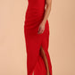 Model wearing Sabrina Maxi Dress with square neckline, sleeveless style, pleating details and side open split, open back in Scarlet Red front side