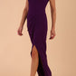 Model wearing Sabrina Maxi Dress with square neckline, sleeveless style, pleating details and side open split, open back in Passion Purple front side