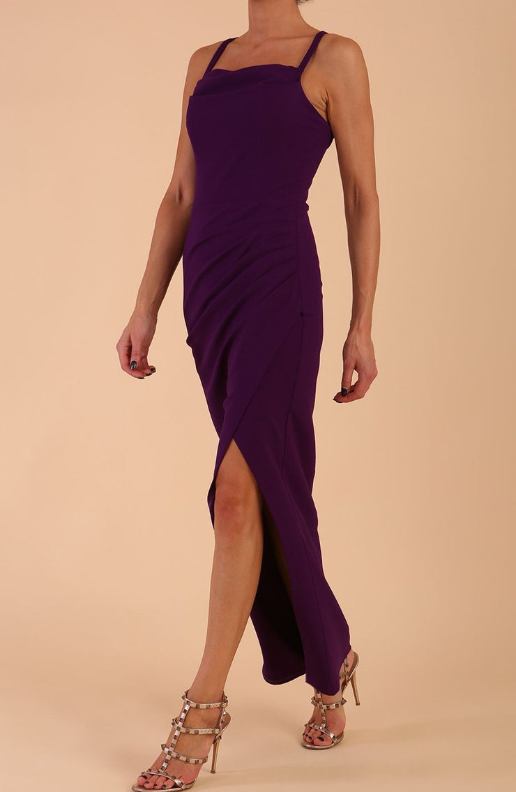 Model wearing Sabrina Maxi Dress with square neckline, sleeveless style, pleating details and side open split, open back in Passion Purple front side