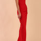 Model wearing Sabrina Maxi Dress with square neckline, sleeveless style, pleating details and side open split, open back in Scarlet Red front side
