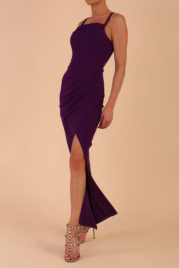 Model wearing Sabrina Maxi Dress with square neckline, sleeveless style, pleating details and side open split, open back in Passion Purple front side