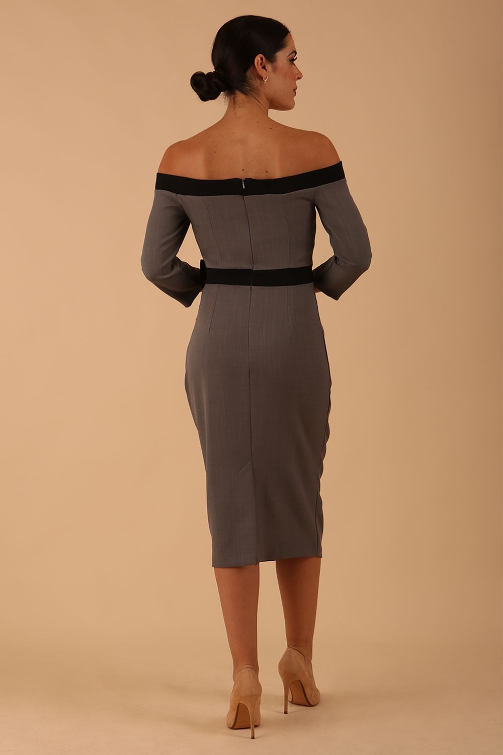 Model wearing a diva catwalk Brittany Off Shoulder Bow detail Pencil Dress with 3/4 sleeves and knee length in Castlerock Grey and Black colour