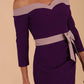 Model wearing a diva catwalk Brittany Off Shoulder Bow detail Pencil Dress with 3/4 sleeves and knee length in Deep Purple and Thunder Bird colour front detail