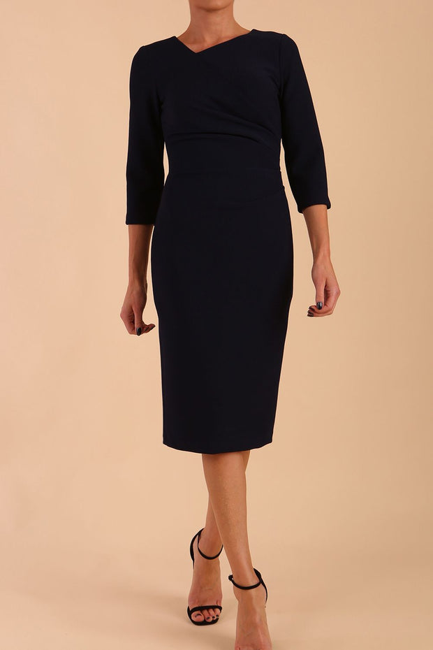 Model wearing DIVA Catwalk Peppard 3/4 Sleeve Pencil Dress in Cameo fabric knee length in navy blue colour front image
