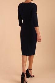 Model wearing DIVA Catwalk Peppard 3/4 Sleeve Pencil Dress in Cameo fabric knee length in navy blue colour back image