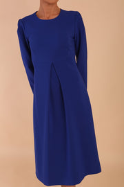 Model wearing diva catwalk in Bombay fabric the Epsom Long Sleeve and round neckline and midi A-Line Dress in Royal Blue colour