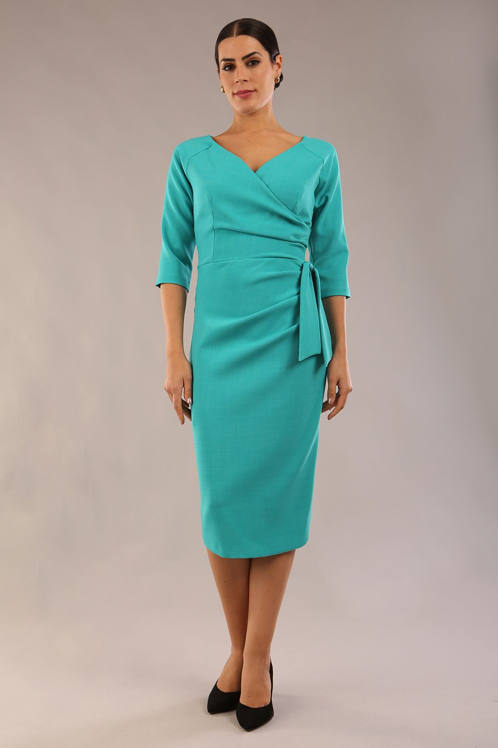 model is wearing a diva catwalk Bronwen 3/4 sleeved Tie Pencil Dress in aqua green colour front