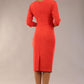 model wearon a diva catwalk Bronwen 3/4 sleeved Tie Pencil Dress in grenadine orange colour back