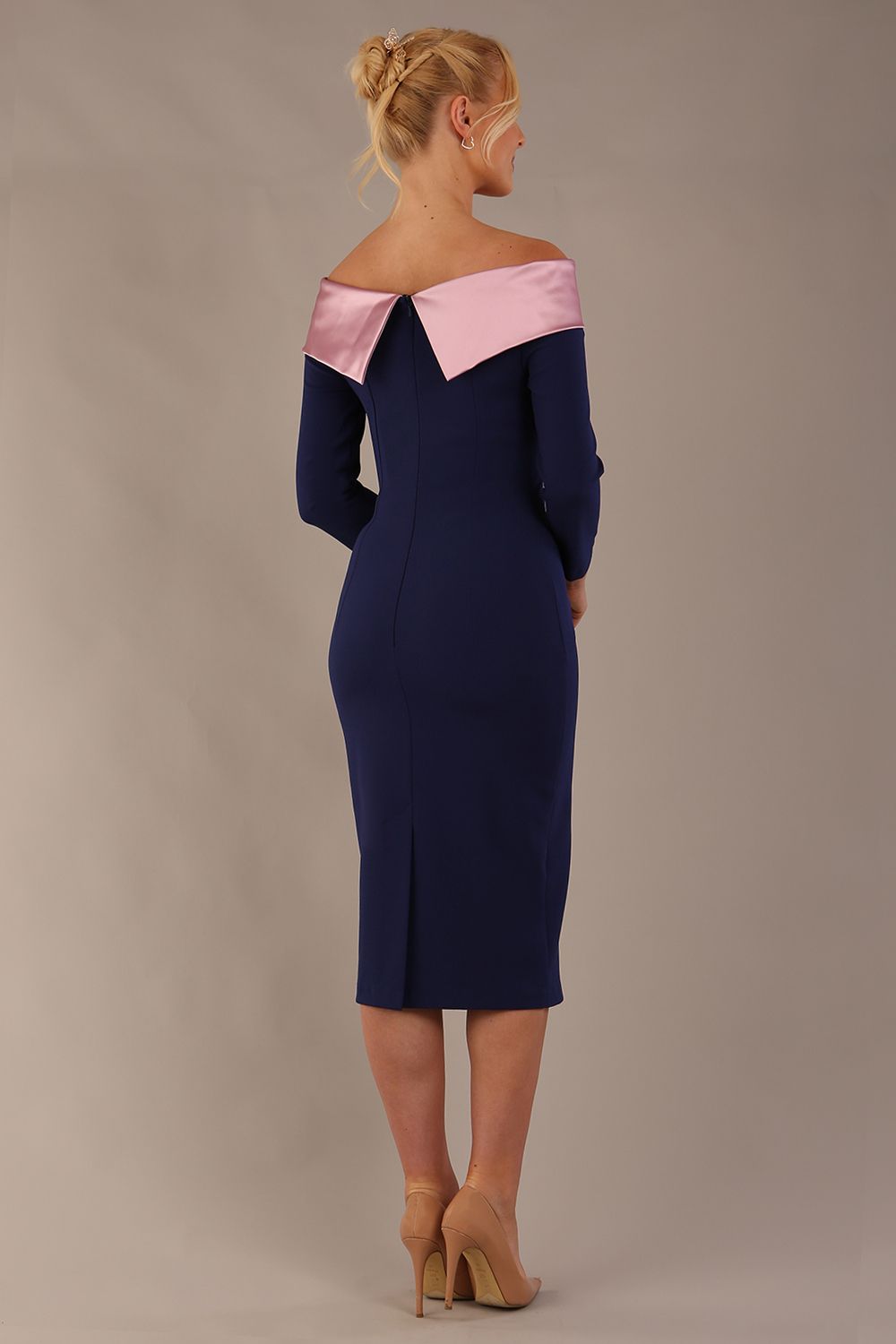 Model is wearing a diva catwalk Rosalind Off Shoulder Bow Detail Pencil Dress 3/4 sleeve in Navy Blue/Lilac Contrast contrast back image (Navy Blue / Lilac Contrast)