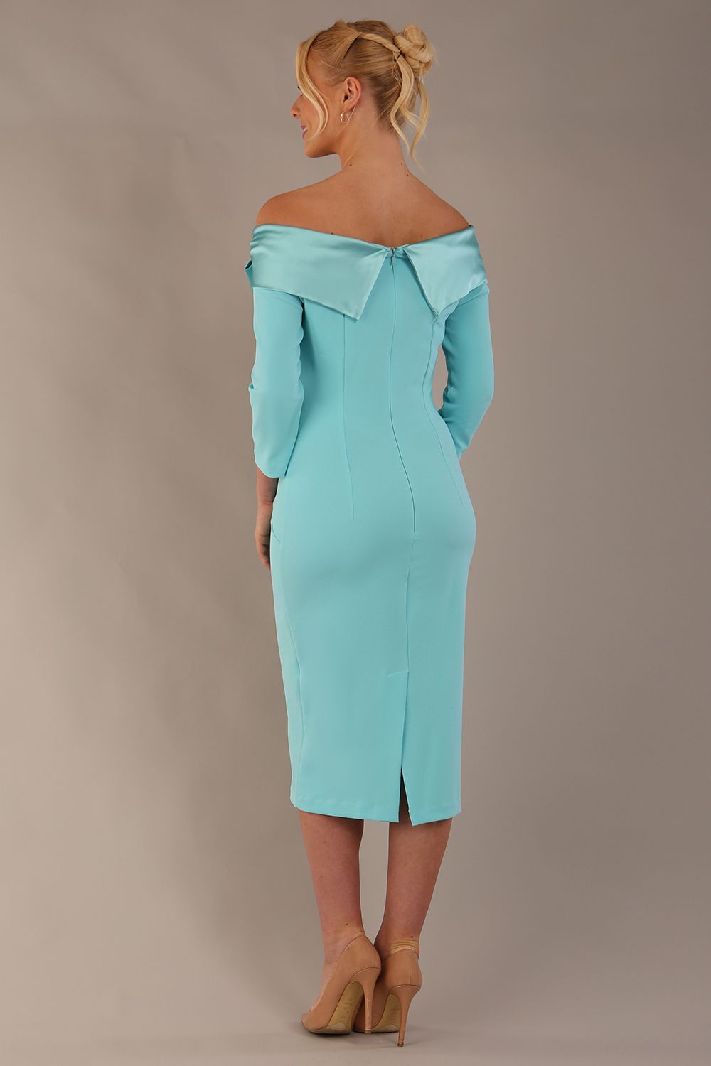Model is wearing a diva catwalk Rosalind Off Shoulder Bow Detail Pencil Dress 3/4 sleeve in Turquoise contrast front image (Turquoise)