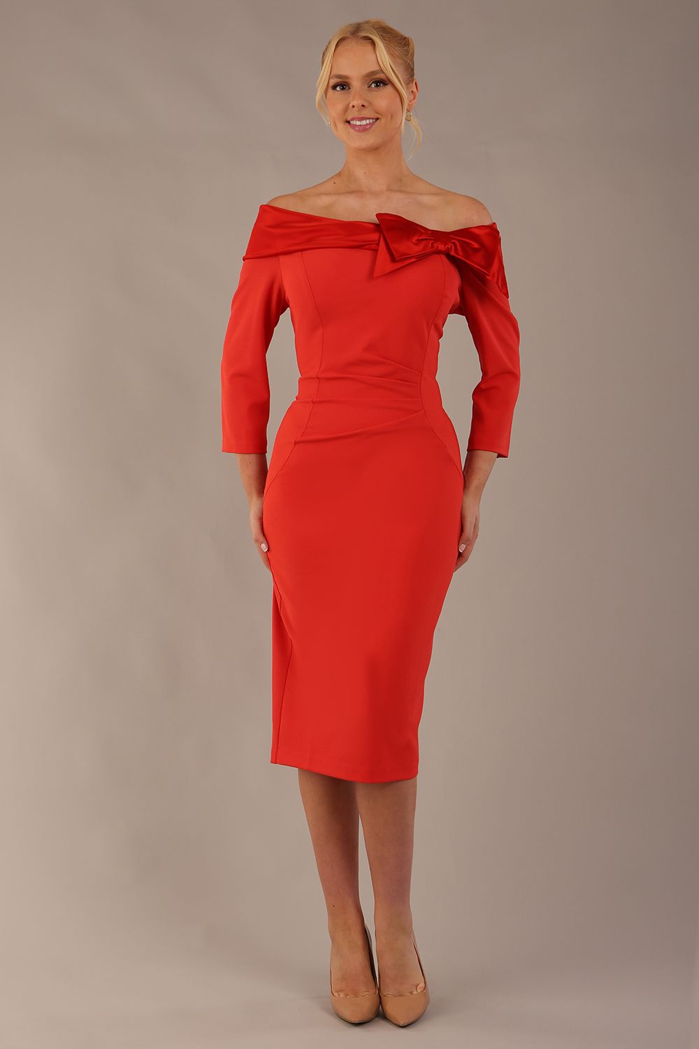 brunette Model is wearing a diva catwalk Rosalind Off Shoulder Bow Detail Pencil Dress 3/4 sleeve in Fiesta Orange/Fire Orange contrast front image (Fiesta Orange / Fire Orange Contrast)