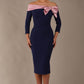 Model is wearing a diva catwalk Rosalind Off Shoulder Bow Detail Pencil Dress 3/4 sleeve in Navy Blue/Lilac Contrast contrast front image (Navy Blue / Lilac Contrast)