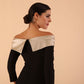Model wearing a Rosalind Off Shoulder Bow Detail Pencil Dress 3/4 sleeve in Black/Champagne contrast back close up