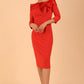 Model wearing a Rosalind Off Shoulder Bow Detail Pencil Dress 3/4 sleeve in Passion Red colour