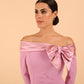 Model wearing a Rosalind Off Shoulder Bow Detail Pencil Dress 3/4 sleeve in Dawn Pink colour close up
