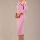 brunette Model is wearing a diva catwalk Rosalind Off Shoulder Bow Detail Pencil Dress 3/4 sleeve in Dawn Pink contrast front image