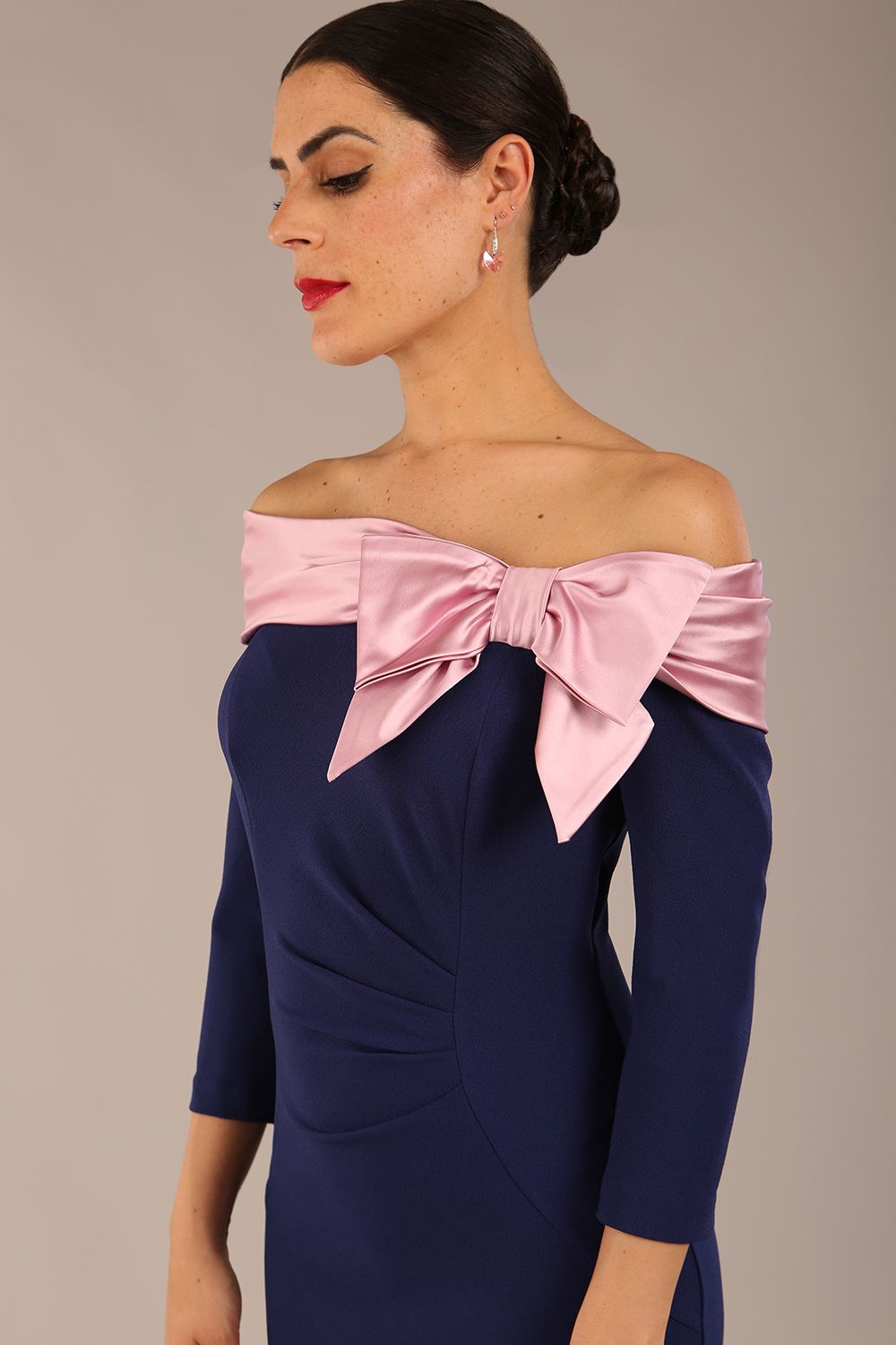 brunette Model is wearing a diva catwalk Rosalind Off Shoulder Bow Detail Pencil Dress 3/4 sleeve in Navy Blue/Lilac Contrast contrast front image