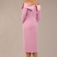 brunette Model is wearing a diva catwalk Rosalind Off Shoulder Bow Detail Pencil Dress 3/4 sleeve in Dawn Pink contrast back image