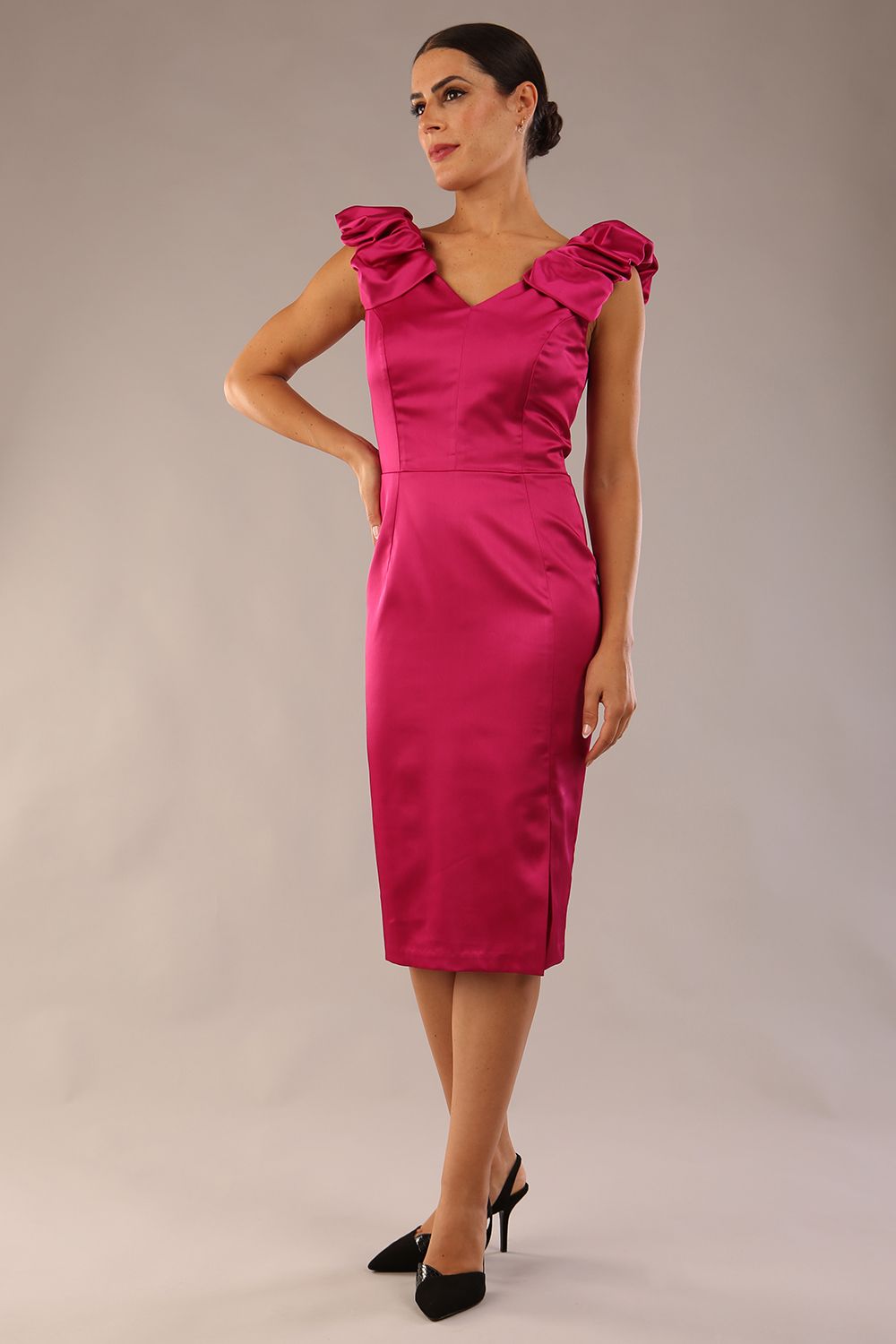 model is wearing a diva catwalk Prudence Satin Pencil Dress sleeveless and knee length with front vent in magenta colour