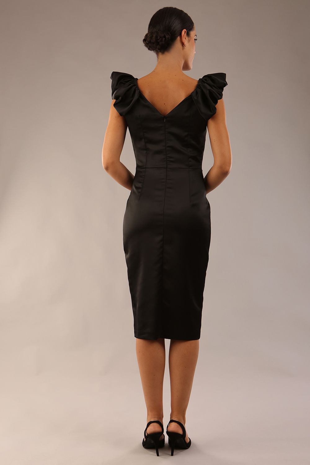 model is wearing a diva catwalk Prudence Satin Pencil Dress sleeveless and knee length with front vent in black colour back image