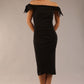 model is wearing a diva catwalk Strand Off-Shoulder Bow Tie Dress midi length and pleated skirt in black colour