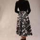 model is wearing a Gwendolyn Midi Length Skirt in Floral Print satin black and white a-line midi length skirt