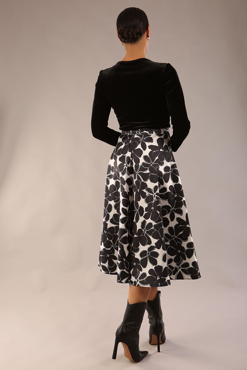 model is wearing a Gwendolyn Midi Length Skirt in Floral Print satin black and white a-line midi length skirt