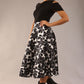 model is wearing a Gwendolyn Midi Length Skirt in Floral Print satin black and white a-line midi length skirt